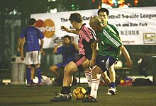 Action from the MasterCard ClubFootball Midweek League - photo by Lu Qiang of City Weekend