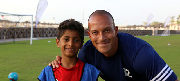 Bobby Zamora with football camp participant